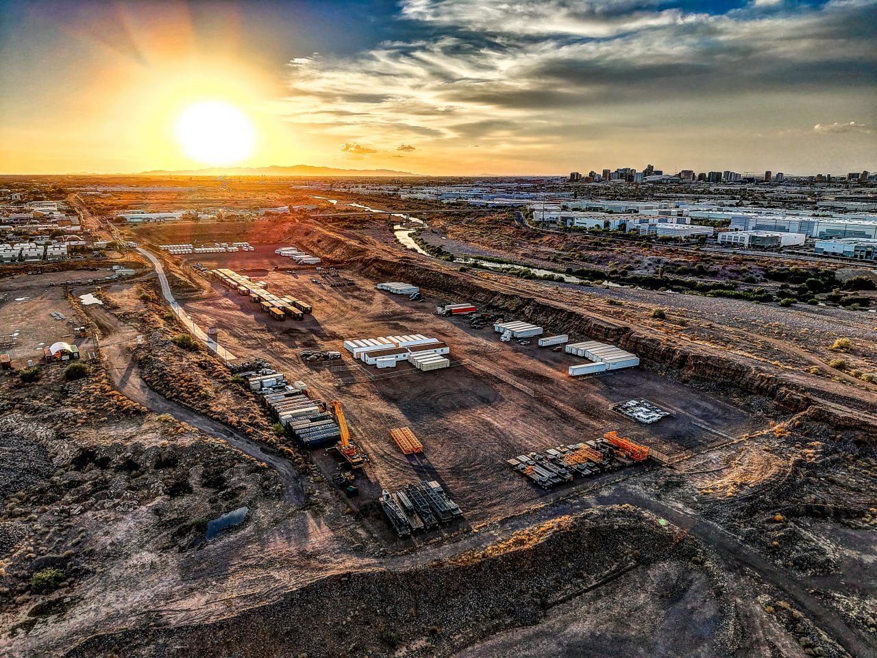 The yard at sunset, looking west across the graded pad